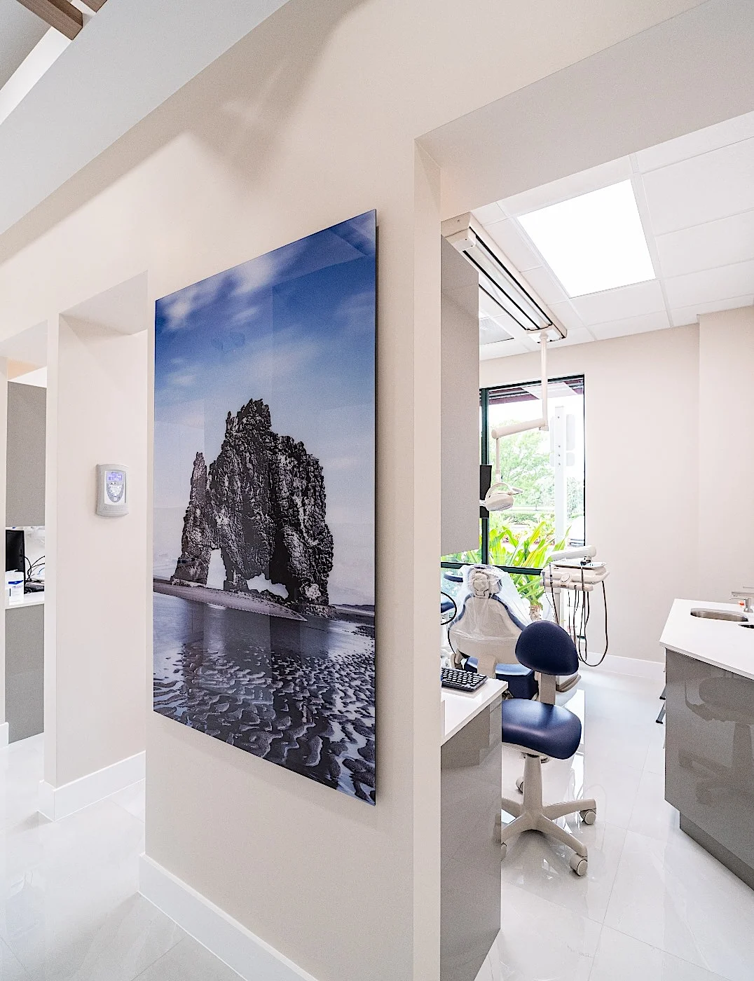 Clear Smiles Dental — Panel of a sea stack beside the doorway to a treatment room