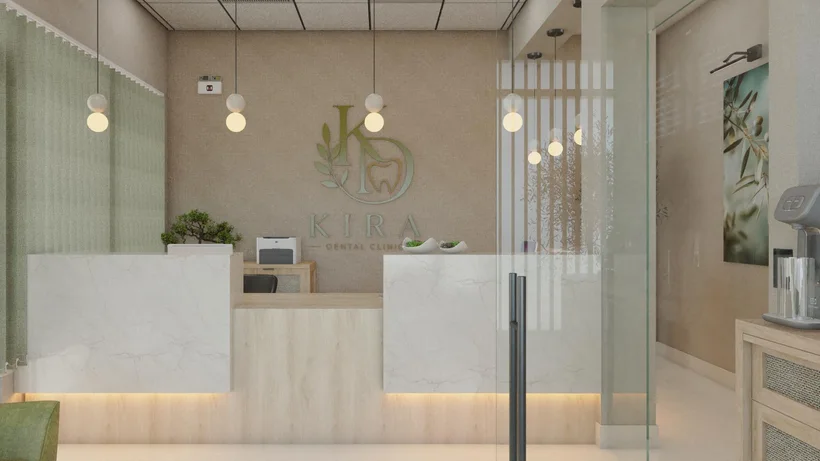 Kira Dental Clinic — Reception with a white veined counter under globe pendants and a green logo on a linen-textured wall