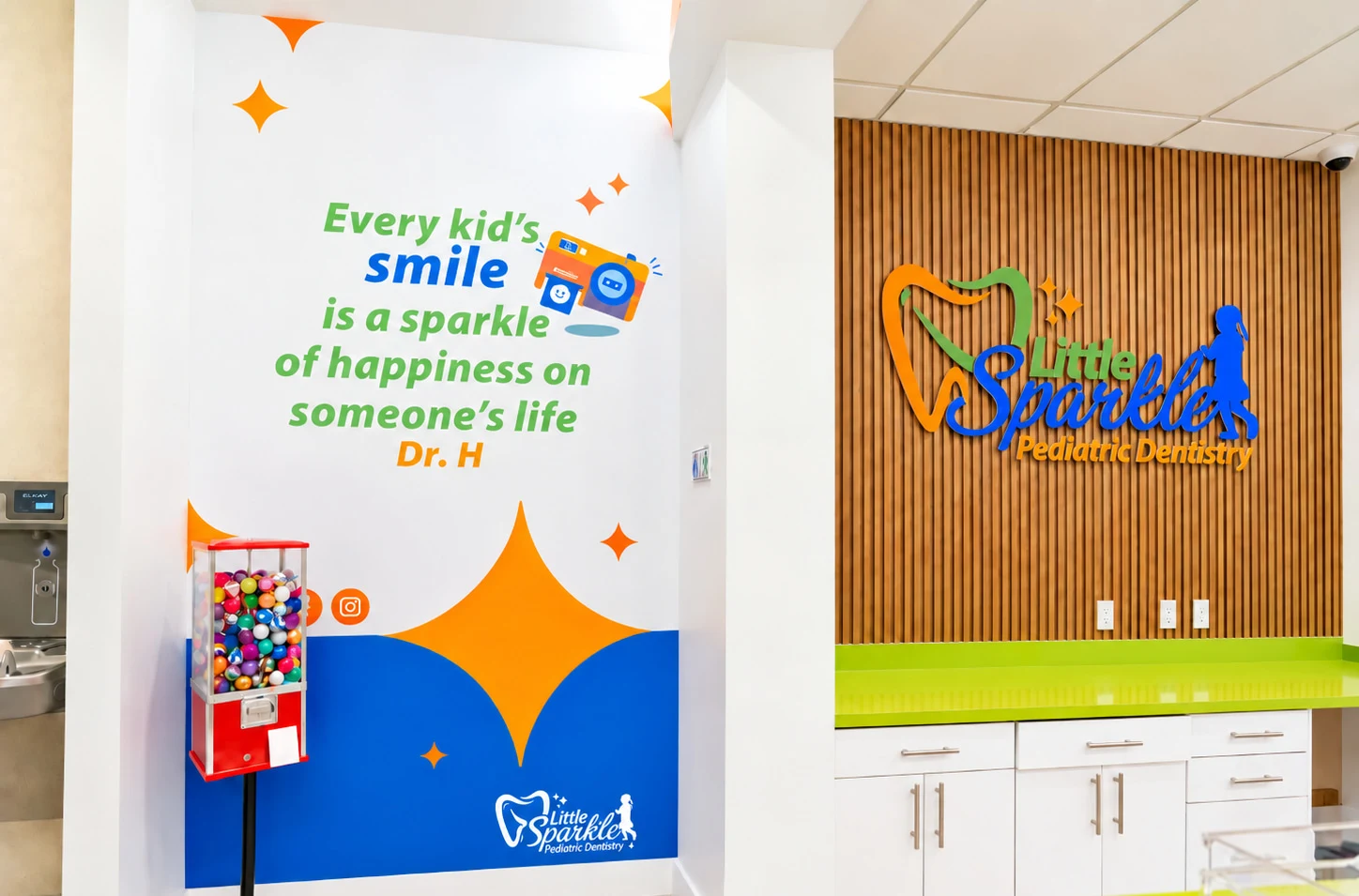 Little Sparkle Pediatric Dentistry — Reception wall with a quote in green and blue lettering over a large orange star, beside a dimensional logo on timber slats