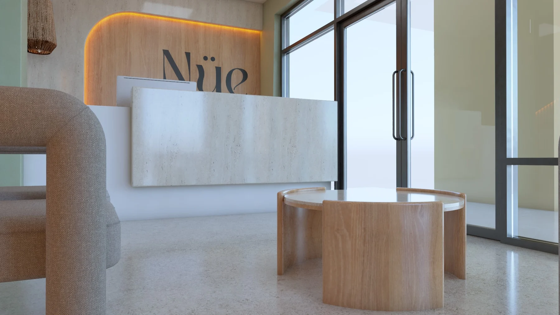 Nüe Dental Clinic — Low view of the stone-look reception desk before a backlit wood logo panel, with a round wood table