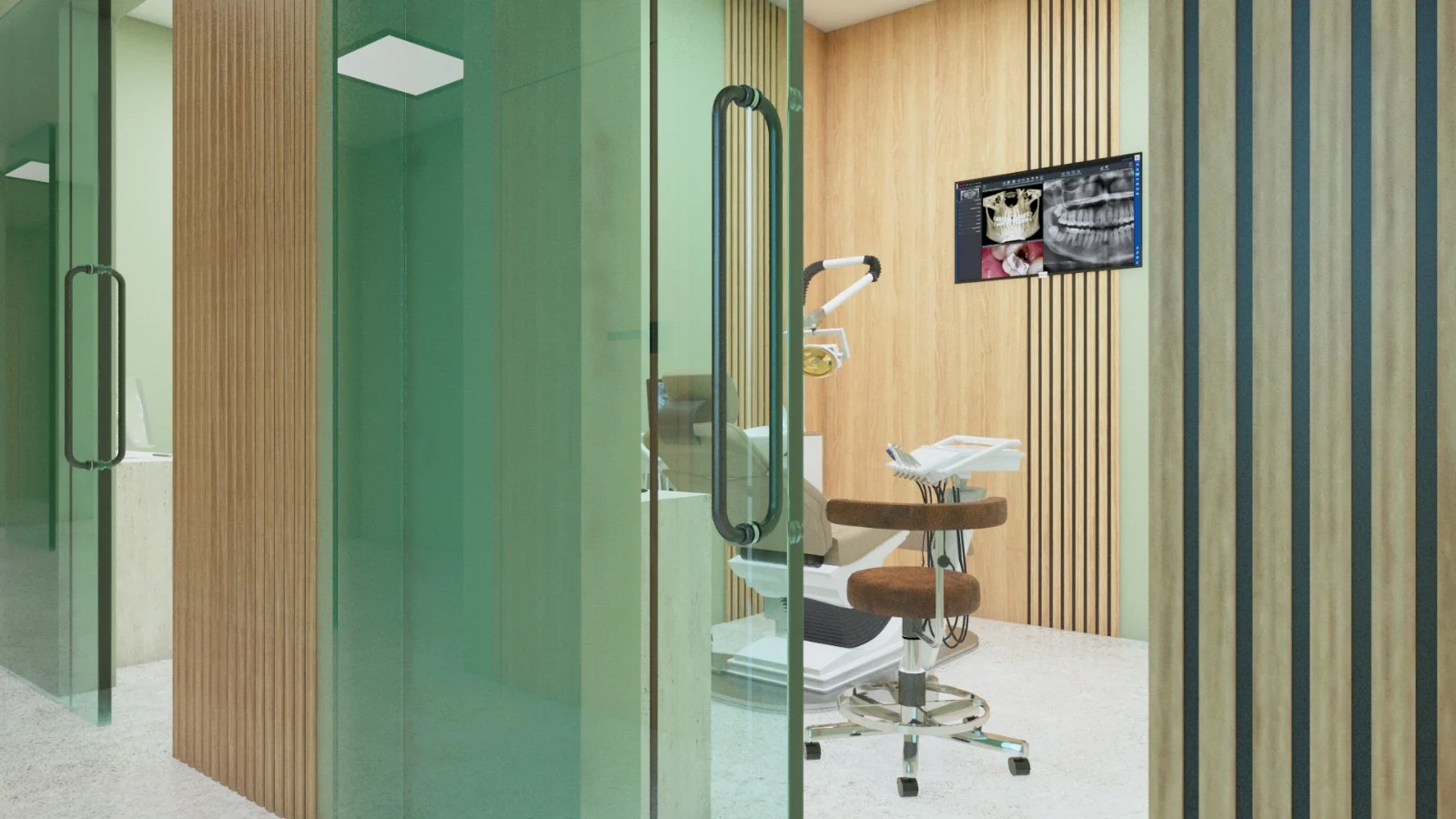 Nüe Dental Clinic — Treatment room seen through a green glass door, with a dental chair and a wall screen showing X-rays