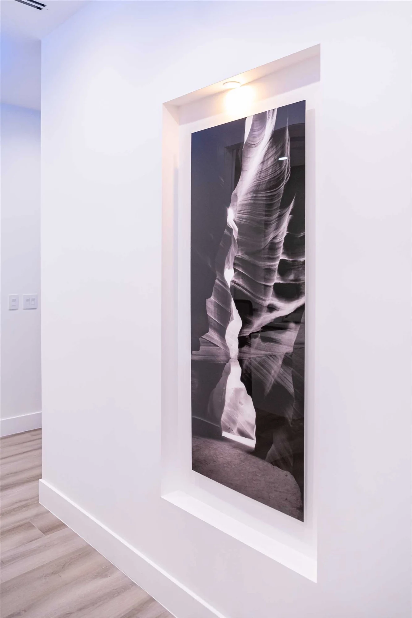 Select Dental Care — Black-and-white slot canyon photograph set into a recessed wall niche