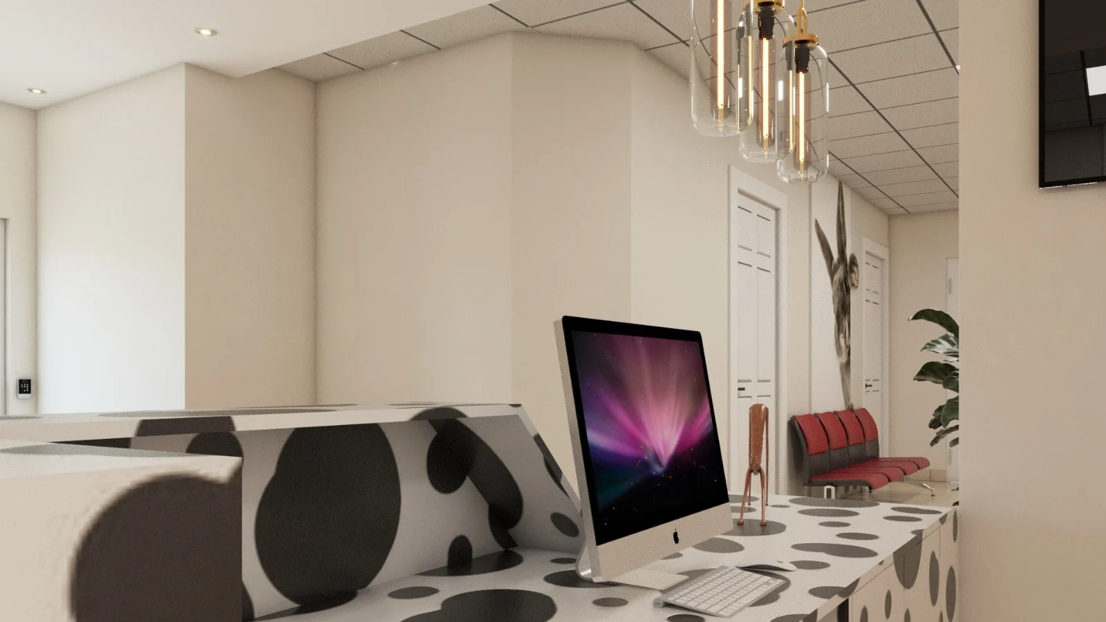 Veterinary Clinic — Close-up of the spotted reception counter with a computer, glass pendants and a rabbit mural beyond